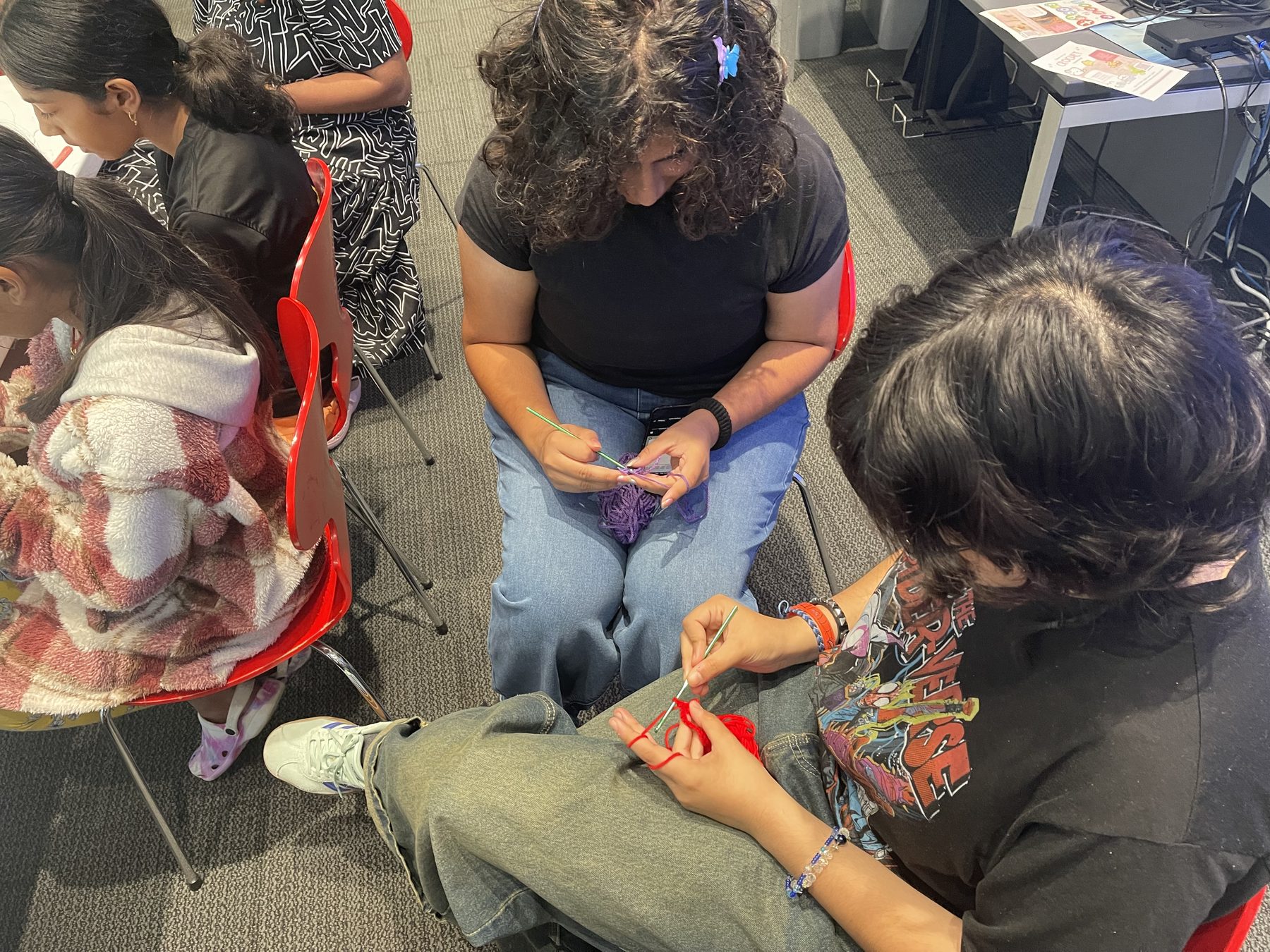 Participants crocheting together